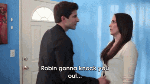 a man and a woman are standing in front of a door and the man says robin gonna knock you out