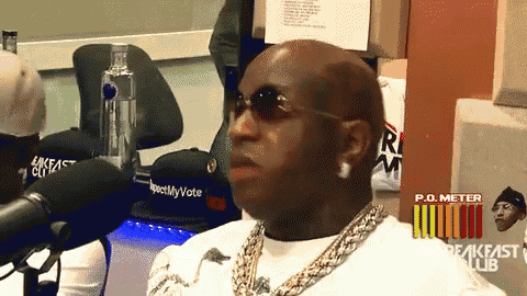 a man wearing sunglasses is sitting in front of a p.o. meter breakfast club