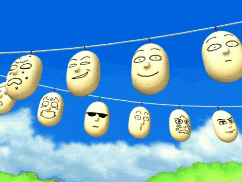 a bunch of faces are hanging on a line with one wearing sunglasses