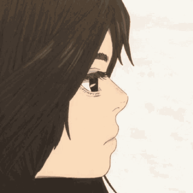 a close up of a woman 's face with long brown hair and a white eye