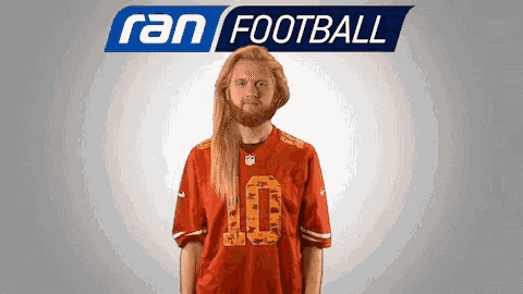 a man with long hair and a beard is wearing a jersey with the number 10 on it