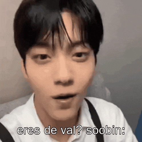 a close up of a person 's face with the words `` eres de val ? soobin '' written above it .