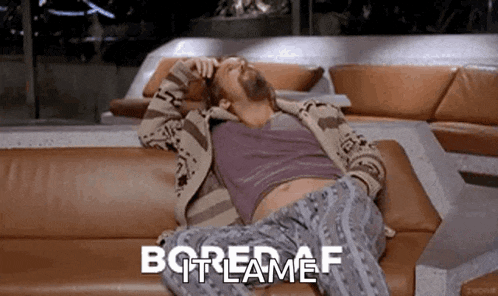 a man with a beard is laying on a couch with the words bored af written on it