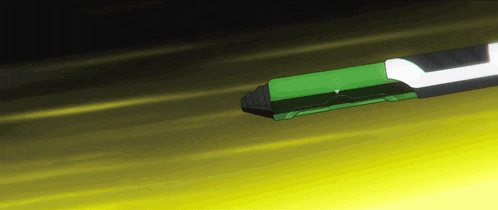 a green and black object is floating in the air on a yellow background