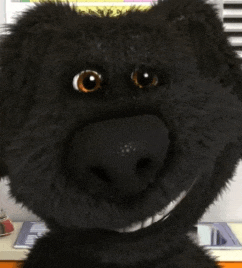 a close up of a stuffed animal 's face with a smiley face