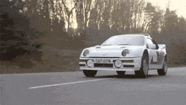a white sports car with the license plate c07 dtm