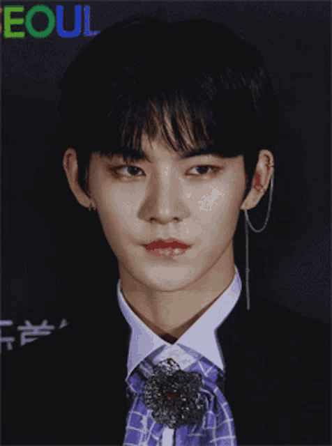a close up of a man 's face with the word seoul in the corner
