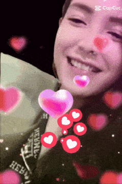 a woman 's face is surrounded by pink and red hearts and says capcut on the bottom