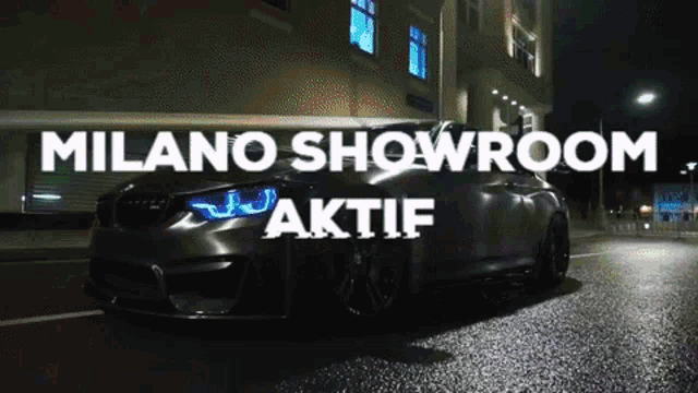 a car is parked on the street in front of a building that says milano showroom aktif