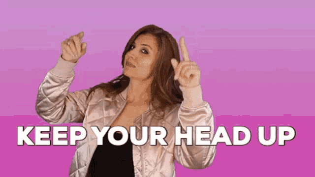 a woman in a bomber jacket is pointing up with the words " keep your head up " behind her