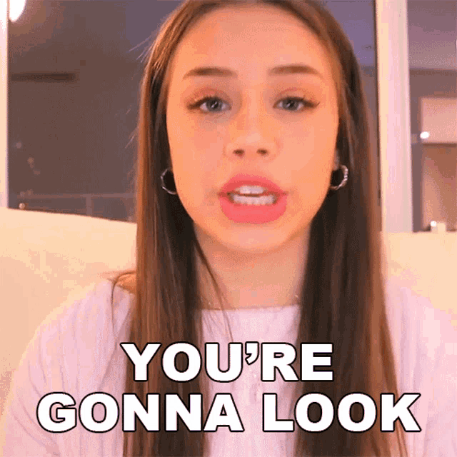 a woman says you 're gonna look while wearing hoop earrings