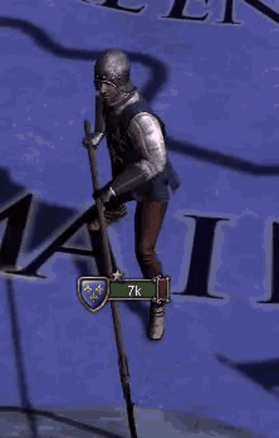 a man in armor is holding a pole in a video game