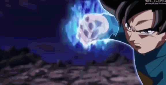 a man in a blue shirt is standing in front of a skull in the air .