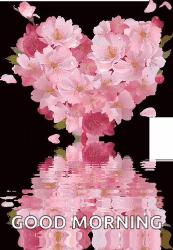 a heart shaped bouquet of pink flowers with the words good morning