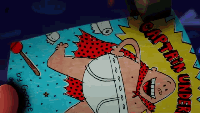 a drawing of captain underpants with a polka dot cape