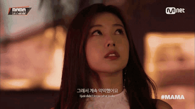 a woman with red hair is on a screen that says mnet