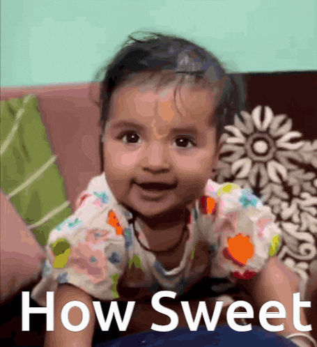 a baby is sitting on a couch with the words how sweet written on the bottom