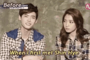a man and a woman are sitting next to each other with the words " when i first met shin hye " on the bottom
