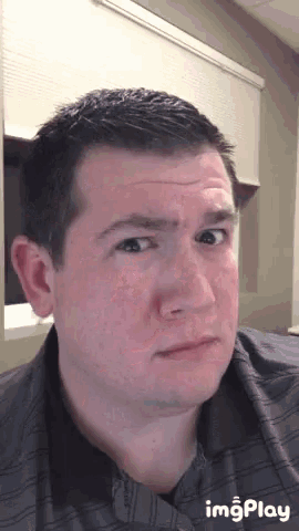 a man is making a funny face with imgplay displayed below him