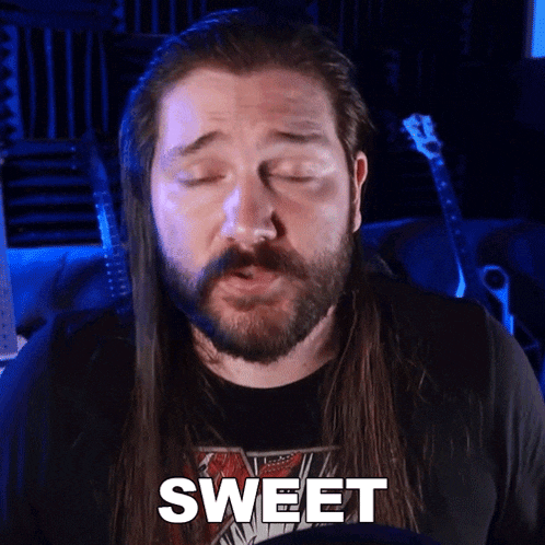 a man with a beard and long hair says sweet