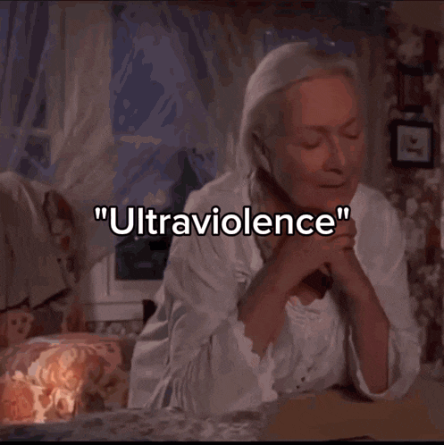 a woman sitting in front of a window with the words " ultraviolence " written below her