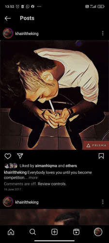 a picture of a man smoking a cigarette is displayed on a phone screen