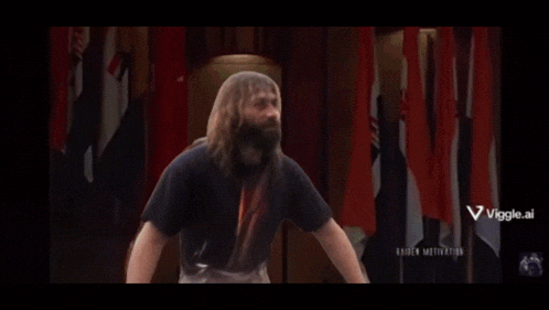 a man with long hair and a beard is in a gym with a viggle.ai logo