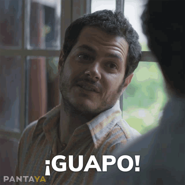 a man with a beard says guapo in a spanish language