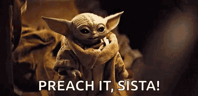a baby yoda from star wars is holding something in its mouth and saying `` preach it , sista '' .