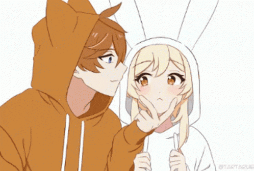 a boy in a cat hoodie kisses a girl in a white hoodie
