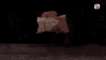 a blurry picture of people standing in a dark room