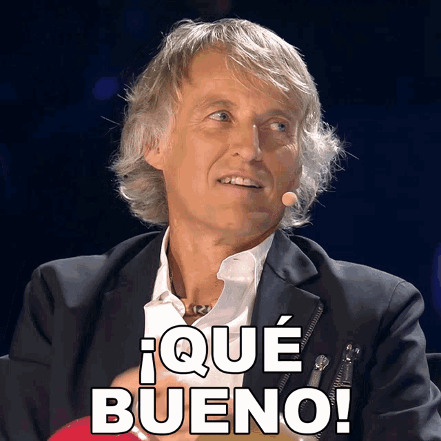 a man in a suit says que bueno