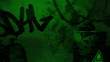 a man without a shirt is standing in front of a green wall with the word hiv written on it