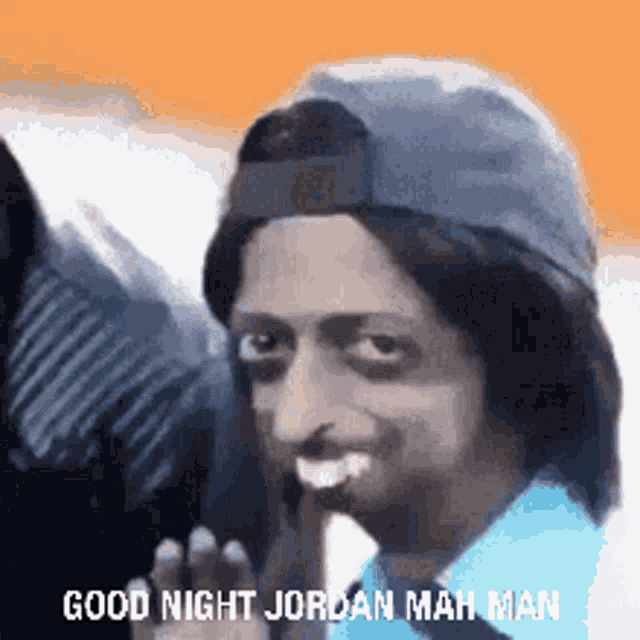 a man wearing a baseball cap and wig is making a funny face and saying `` good night jordan mah man '' .