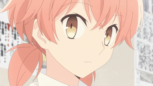 a close up of a girl 's face with pink hair