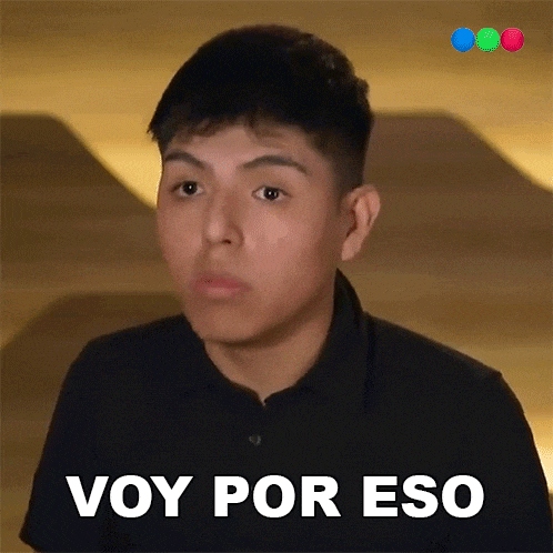a young man in a black shirt has the words voy por eso written on his face