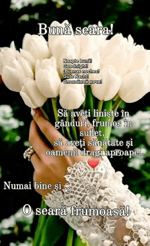 a woman is holding a bouquet of white flowers in her hand .