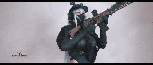 a woman holding a gun with the word cosplay written on the bottom