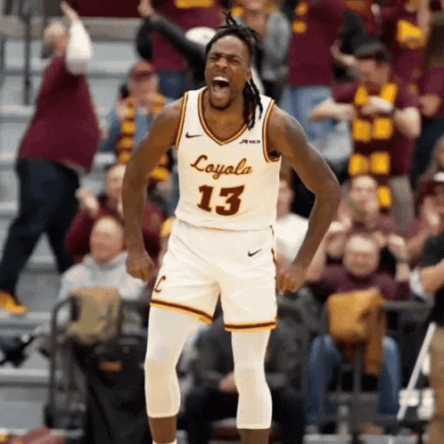 a basketball player wearing a jersey that says coyola 13