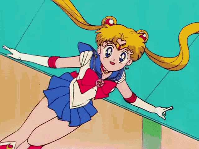 a sailor moon cartoon character is laying on the floor