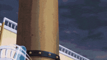 a wooden pole with a black strap around it is in front of a building