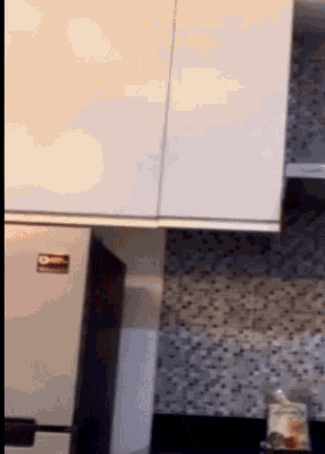 a stainless steel refrigerator has a sticker on it that says ' samsung '