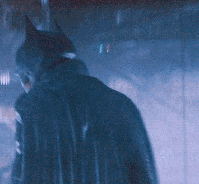 a close up of a person in a batman suit