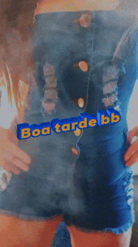 a woman wearing denim shorts with the words boa tarde bb written in blue