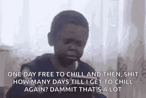 a young boy is crying and smoking a cigarette while sitting on a couch with his eyes closed .