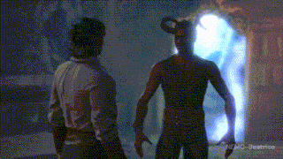 two men are standing next to each other in a dark room and the words nemo-beatrice are on the bottom