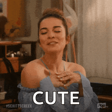 a woman with her eyes closed and the word cute written on her face