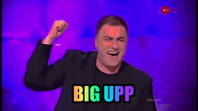 a man with his fist in the air and the words big upp on the bottom