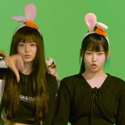 two girls wearing bunny ears headbands are standing next to each other