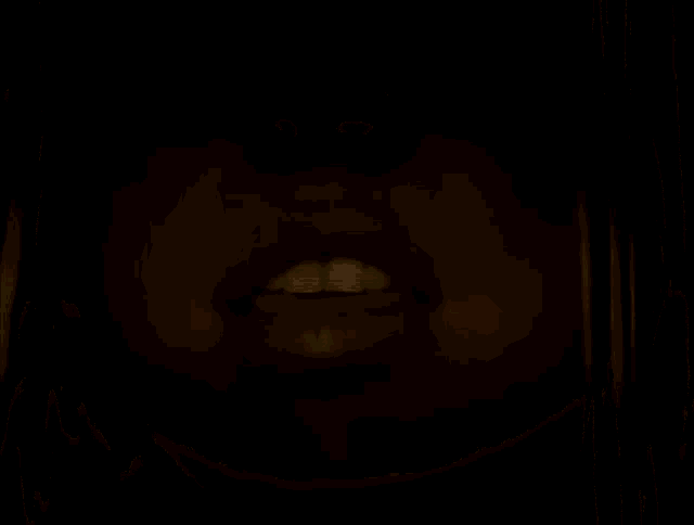 a close up of a woman 's mouth with a tongue sticking out